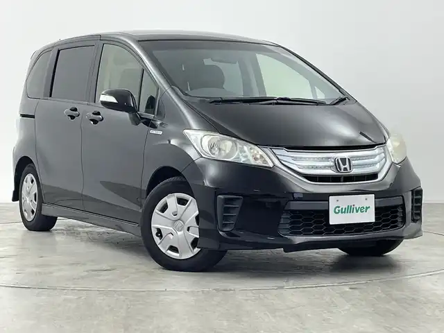 ホンダ フリード ハイブリット ジャストセレクション 群馬県 2015(平27)年 7万km プレミアムスパークルブラックパール 純正ナビ　ワンセグＴＶ　バックカメラ　クルーズコントロール　オートライト　ＨＩＤヘッドライト　両側電動スライドドア　電動格納ミラー　ウィンカーミラー　革巻きステアリング　ＥＴＣ　スマートキー　禁煙車