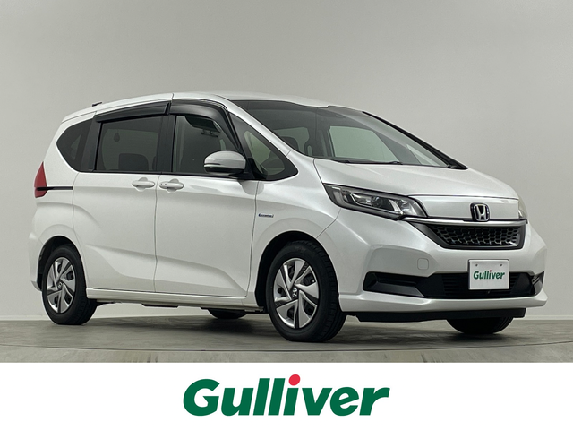 ホンダ フリード ハイブリット G ホンダセンシング 埼玉県 2020(令2)年 0.8万km プラチナホワイトパール 純正ナビ　Ｂカメラ　温シート　追従走行　ＥＴＣ　両側パワースライドドア　コーナーセンサー　衝突軽減システム　レーンキープアシスト　スペアキー　前後ドライブレコーダー　禁煙車　スマートキー