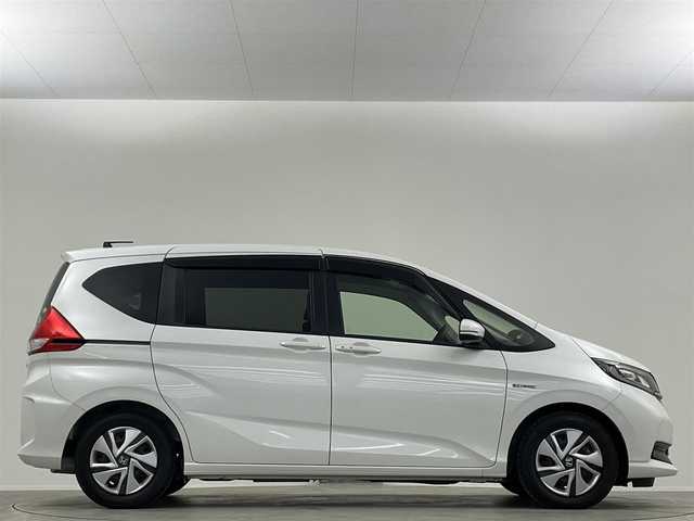 ホンダ フリード ハイブリット G ホンダセンシング 埼玉県 2020(令2)年 0.8万km プラチナホワイトパール 純正ナビ　Ｂカメラ　温シート　追従走行　ＥＴＣ　両側パワースライドドア　コーナーセンサー　衝突軽減システム　レーンキープアシスト　スペアキー　前後ドライブレコーダー　禁煙車　スマートキー
