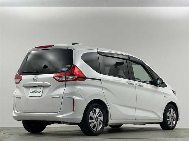 ホンダ フリード ハイブリット G ホンダセンシング 埼玉県 2020(令2)年 0.8万km プラチナホワイトパール 純正ナビ　Ｂカメラ　温シート　追従走行　ＥＴＣ　両側パワースライドドア　コーナーセンサー　衝突軽減システム　レーンキープアシスト　スペアキー　前後ドライブレコーダー　禁煙車　スマートキー