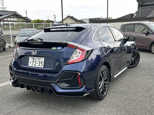 ホンダ シビック ハッチバック 富山県 2020(令2)年 1.3万km オブシダンブルーパール ワンオーナー/純正メモリーナビ(VXM-214VFi)/フルセグテレビ/Bluetooth/バックカメラ/ドライブレコーダー（前後）/ビルトインETC2.0/アイドリングストップ/電動格納ウィンカーミラー/ACC/プッシュスタート/オートライト/パワーシート（D/N）/レーンキープアシスト/横滑り防止/衝突軽減/シートヒーター（D/N）/無限エアロ/保証書・取説・ナビ取説/スマートキー（スマートキー）