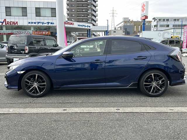 ホンダ シビック ハッチバック 富山県 2020(令2)年 1.3万km オブシダンブルーパール ワンオーナー/純正メモリーナビ(VXM-214VFi)/フルセグテレビ/Bluetooth/バックカメラ/ドライブレコーダー（前後）/ビルトインETC2.0/アイドリングストップ/電動格納ウィンカーミラー/ACC/プッシュスタート/オートライト/パワーシート（D/N）/レーンキープアシスト/横滑り防止/衝突軽減/シートヒーター（D/N）/無限エアロ/保証書・取説・ナビ取説/スマートキー（スマートキー）