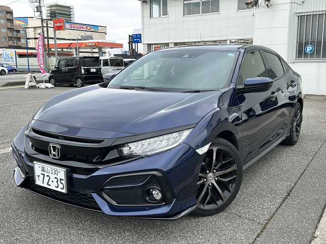 ホンダ シビック ハッチバック 富山県 2020(令2)年 1.3万km オブシダンブルーパール ワンオーナー/純正メモリーナビ(VXM-214VFi)/フルセグテレビ/Bluetooth/バックカメラ/ドライブレコーダー（前後）/ビルトインETC2.0/アイドリングストップ/電動格納ウィンカーミラー/ACC/プッシュスタート/オートライト/パワーシート（D/N）/レーンキープアシスト/横滑り防止/衝突軽減/シートヒーター（D/N）/無限エアロ/保証書・取説・ナビ取説/スマートキー（スマートキー）