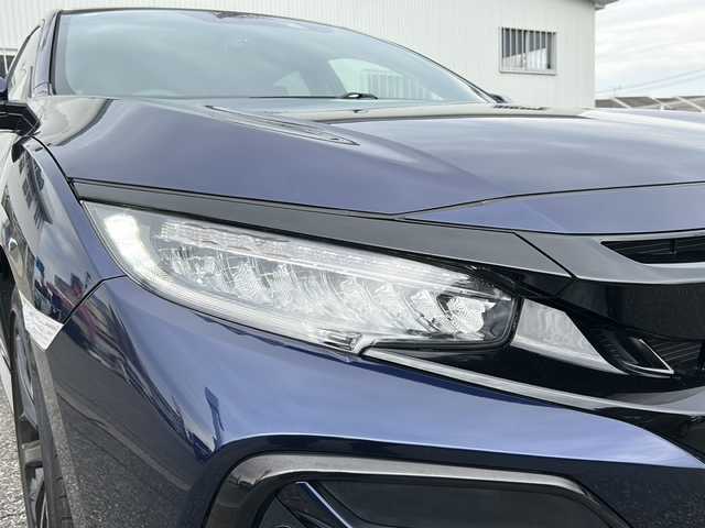 ホンダ シビック ハッチバック 富山県 2020(令2)年 1.3万km オブシダンブルーパール ワンオーナー/純正メモリーナビ(VXM-214VFi)/フルセグテレビ/Bluetooth/バックカメラ/ドライブレコーダー（前後）/ビルトインETC2.0/アイドリングストップ/電動格納ウィンカーミラー/ACC/プッシュスタート/オートライト/パワーシート（D/N）/レーンキープアシスト/横滑り防止/衝突軽減/シートヒーター（D/N）/無限エアロ/保証書・取説・ナビ取説/スマートキー（スマートキー）