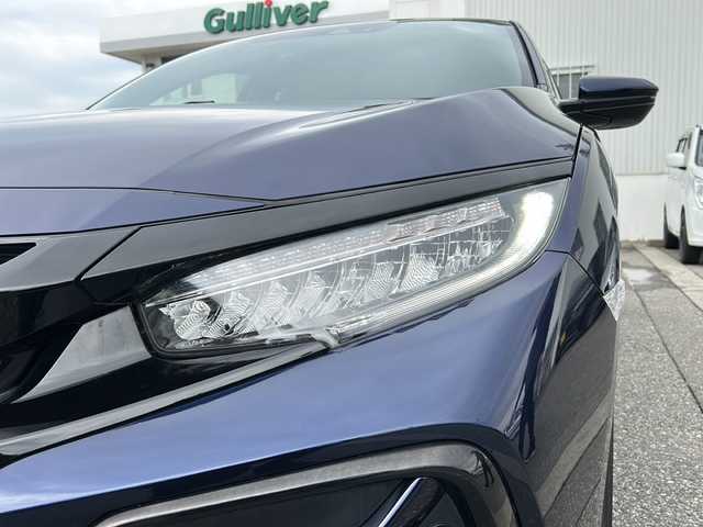 ホンダ シビック ハッチバック 富山県 2020(令2)年 1.3万km オブシダンブルーパール ワンオーナー/純正メモリーナビ(VXM-214VFi)/フルセグテレビ/Bluetooth/バックカメラ/ドライブレコーダー（前後）/ビルトインETC2.0/アイドリングストップ/電動格納ウィンカーミラー/ACC/プッシュスタート/オートライト/パワーシート（D/N）/レーンキープアシスト/横滑り防止/衝突軽減/シートヒーター（D/N）/無限エアロ/保証書・取説・ナビ取説/スマートキー（スマートキー）