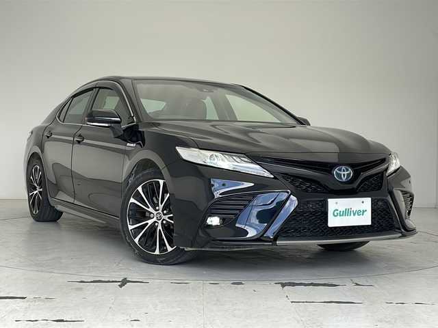 トヨタ カムリ WSレザーパッケージ 沖縄県 2019(平31)年 2.1万km アティチュードブラックマイカ 純正８型ディスプレイオーディオ　/　(フルセグTV　Bluetooth　CD　DVD)/バックカメラ　/ETC/トヨタセーフティセンス　/・衝突被害軽減ブレーキ (プリクラッシュセーフティ)																									/・ハンドル操作サポート (レーントレーシングアシスト)																									/・追従ドライブ支援機能 (レーダークルーズコントロール)																									/・車線はみ出しアラート (レーンディパーチャーアラート)																									/・自動ハイビーム (オートマチックハイビーム)																									/パワーシート　/シートヒーター/レザーシート　/ＬＥＤヘッドライト　/オートライト/クリアランスソナー/純正フロアマット/純正１８インチアルミホイール/スマートキー/プッシュスタート