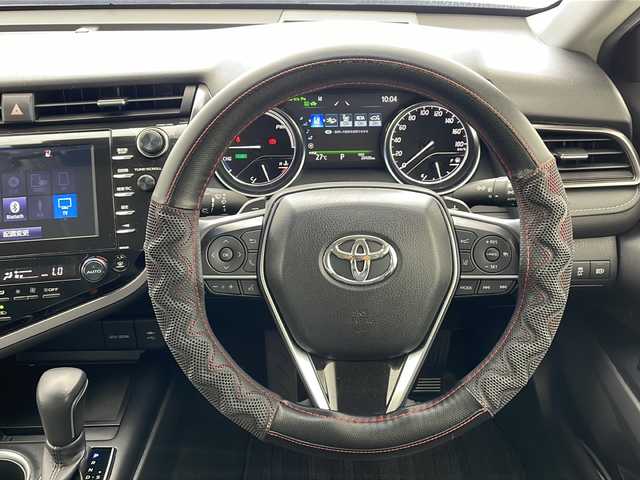 トヨタ カムリ WSレザーパッケージ 沖縄県 2019(平31)年 2.1万km アティチュードブラックマイカ 純正８型ディスプレイオーディオ　/　(フルセグTV　Bluetooth　CD　DVD)/バックカメラ　/ETC/トヨタセーフティセンス　/・衝突被害軽減ブレーキ (プリクラッシュセーフティ)																									/・ハンドル操作サポート (レーントレーシングアシスト)																									/・追従ドライブ支援機能 (レーダークルーズコントロール)																									/・車線はみ出しアラート (レーンディパーチャーアラート)																									/・自動ハイビーム (オートマチックハイビーム)																									/パワーシート　/シートヒーター/レザーシート　/ＬＥＤヘッドライト　/オートライト/クリアランスソナー/純正フロアマット/純正１８インチアルミホイール/スマートキー/プッシュスタート