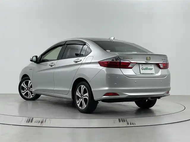 ホンダ グレイス ハイブリッド EX 埼玉県 2015(平27)年 6.6万km アラバスターシルバーメタリック 純正ナビ/VXM-152VFi/ CD/DVD/Bluetooth/地デジ/ 　ナビ装着用スペシャルパッケージ/フルオートエアコン＆リアエアコンアウトレット/【フロント】ハーフシェイドガラス＆【リア】プライバシーガラス＋ソフトプライバシーガラス/運転席ハイトアジャスター＆テレスコピック＆チルトステアリングＶＳＡ・エマジェンシーストップシグナル/ヒルスタートアシスト/電動格納ドアミラー・ドアミラーウィンカー/IRカット(遮熱)機能付ガラス(フロントウィンドウ＆フロントドア)/プラズマクラスター機能付きフルオートエアコン/Ｈｏｎｄａスマートキーシステム/ＬＥＤヘッドライト(ロービーム)＋オートレベリング＋オートコントロール/クルーズコントロール/セキュリティアラーム/１６インチアルミホイール/あんしんパッケージ/コンフォートビューパッケージ/運転席＆助手席ヒーテッドシート/パワースイッチシートヒーター