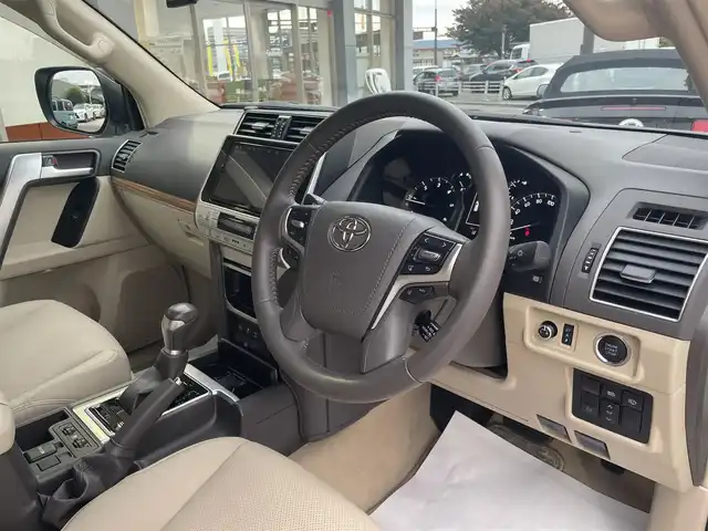 トヨタ ランドクルーザー プラド TX Lパッケージ 香川県 2023(令5)年 0.9万km ホワイトパールクリスタルシャイン 純正ナビ/【Bluetooth/DVD/CD】/フルセグテレビ/バックカメラ/シートヒーター/エアシート/パワーシート/プッシュスタート/オートマチックハイビーム/ETC/純正フロアマット