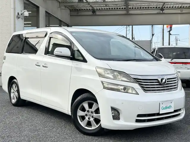 トヨタ ヴェルファイア 2．4X 埼玉県 2010(平22)年 8.3万km ホワイトパールクリスタルシャイン ・純正ナビ：フルセグテレビ/・バックカメラ/・ETC/・ステアリングリモコン/・プッシュスタート/・スマートキー/・オートライト/・横滑り防止/・パーキングセンサー/・コーナーセンサー/・HIDヘッドライト/・フォグランプ/・取扱説明書/・スペアキー１個