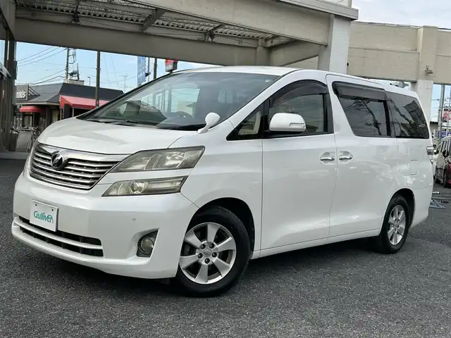 トヨタ ヴェルファイア 2．4X 埼玉県 2010(平22)年 8.3万km ホワイトパールクリスタルシャイン ・純正ナビ：フルセグテレビ/・バックカメラ/・ETC/・ステアリングリモコン/・プッシュスタート/・スマートキー/・オートライト/・横滑り防止/・パーキングセンサー/・コーナーセンサー/・HIDヘッドライト/・フォグランプ/・取扱説明書/・スペアキー１個