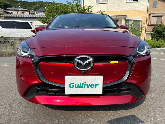 マツダ マツダ２ 15BD 福岡県 2023(令5)年 0.6万km ソウルレッドクリスタルM ワンオーナー/純正ナビ/（AM/FM/USB/Bluetooth/フルセグTV）/アラウンドビューモニター/横滑り防止/レーンキープ/衝突軽減ブレーキ/ブラインドスポットモニタリング/アイドリングストップ/ドライブレコーダー（前後）/パーキングアシスト/ハンズフリー/ビルドインETC/VIEWボタン/オートライト/電格ミラー/プッシュスタート/保証書/取扱説明書/スペアキー×１