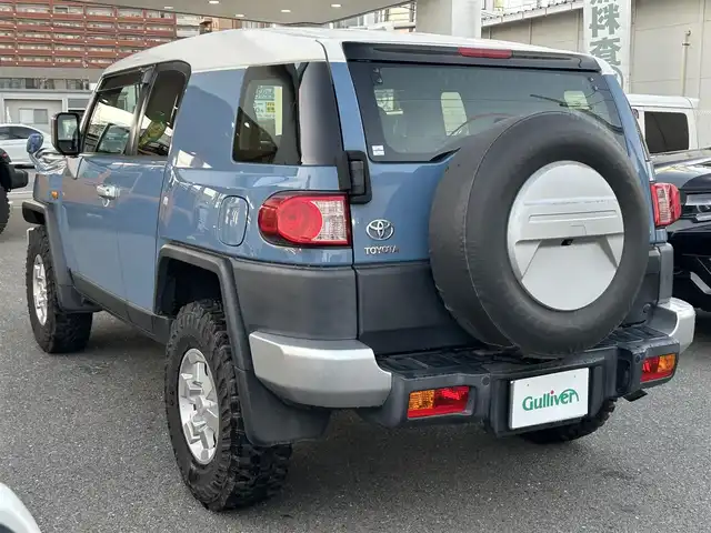 トヨタ ＦＪクルーザー カラーパッケージ 福岡県 2016(平28)年 4.2万km ライトブルー Panasonic製ナビ（CN-RX02WD）/（AM/FM/BT/DVD/フルセグTV）/クルーズコントロール/バックカメラ/背面タイヤ/ETC/クリアランスソナー/フォグライト（リア/フロント）/社外16インチアルミホイール/横滑り防止装置/ステアリングスイッチ/ドアバイザー/取扱説明書/保証書
