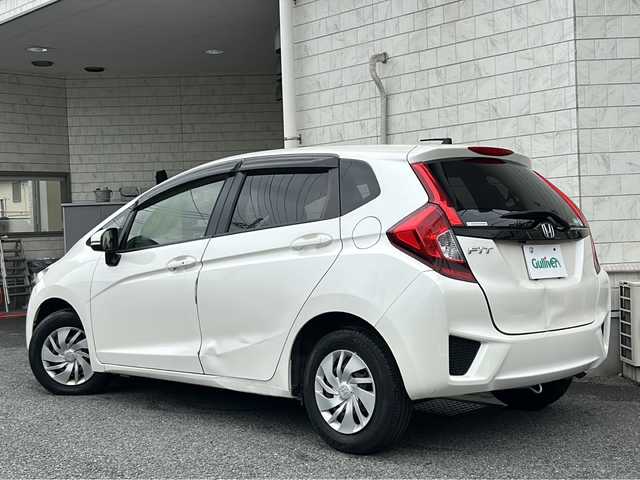 ホンダ フィット 13G Fパッケージ 神奈川県 2016(平28)年 14.3万km プレミアムホワイトパールⅡ ワンオーナー/ナビ（SD/CD/DVD/BT/TV）/バックカメラ/ETC/横滑り防止装置/盗難防止装置/純正フロアマット/電動格納ウィンカーミラー/ステアリングスイッチ/取扱説明書/保証書/スペアキー×１