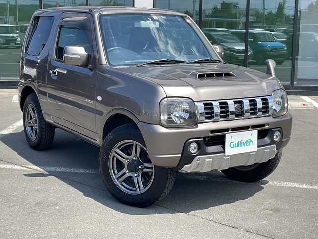 スズキ ジムニー クロスアドベンチャー 道東・釧路十勝 2014(平26)年 5.3万km ガイアブロンズPM ・４WD/・社外ディスプレイオーディオ/（AM・FM・BT・CD）/・フォグライト/・電動格納ミラー/・背面タイヤ/・ドアバイザー/・ETC/・リモコンキー/・レザーシート/・運転席シートヒーター