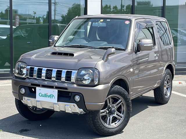 スズキ ジムニー クロスアドベンチャー 道東・釧路十勝 2014(平26)年 5.3万km ガイアブロンズPM ・４WD/・社外ディスプレイオーディオ/（AM・FM・BT・CD）/・フォグライト/・電動格納ミラー/・背面タイヤ/・ドアバイザー/・ETC/・リモコンキー/・レザーシート/・運転席シートヒーター