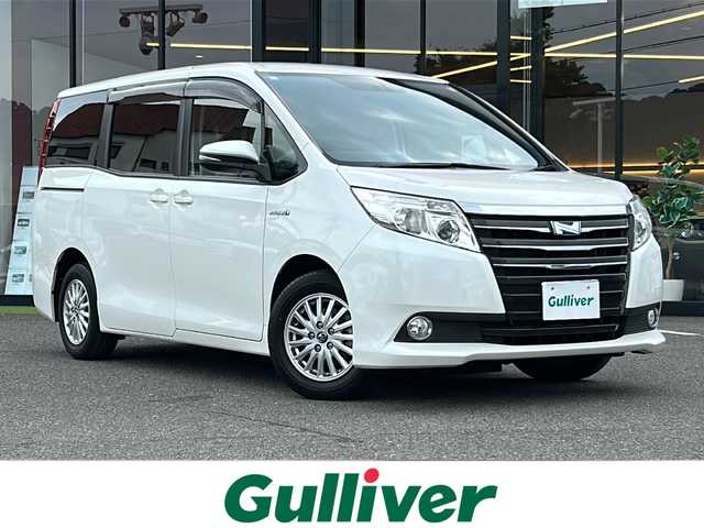 トヨタ ノア ハイブリッド G 大阪府 2015(平27)年 6.4万km ホワイトパールクリスタルシャイン ワンオーナー　アルパイン１０型ナビ　CD DVD BT HDMI SD フルセグTV アルパインフリップダウンモニター　バックカメラ　　両側パワースライドドア　　純正エンジンスターター　ドラレコ　　前席シートヒーター　　ビルトインＥＴＣ　置くだけ充電　LEDオートライト　社外AWスタッドレス４本積み込み