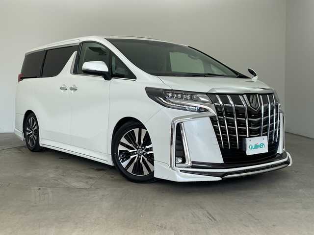 トヨタ アルファード S Cパッケージ 兵庫県 2021(令3)年 2.6万km ホワイトパールクリスタルシャイン ・Wサンルーフ/・社外エアロ/・社外4本出しマフラー/・ダウンサス/・トヨタセーフティーセンス/・プリクラッシュセーフティ/・レーントレーシングアシスト/・クリアランスソナー/・パーキングサポートブレーキ/・リヤクロストラフィックアラート/・BSM/・ロードサインアシスト/・ナノイー/・レーダークルーズコントロール/・オートマチックハイビーム/・純正9型ナビ＆フルセグ＆BT＆USB＆DVD/・バックカメラ/・純正12.1型フリップダウンモニター/・両側パワースライドドア/・パワーバックドア/・ビルトインETC2.0/・ステアリングヒーター/・ステアリングリモコン/・デジタルインナーミラー/・社外前後ドライブレコーダー/・合皮シート/・前席シートヒーター/・前席シートベンチレーション/・運転席メモリーシート/・2列目オットマン/・助手席オットマン/・3眼LEDヘッドライト/・フォグ/・オートライト/・スマートキー/・スペアキー/・プッシュスタート/・電子パーキング/・オートホールド/・純正18インチアルミホイール