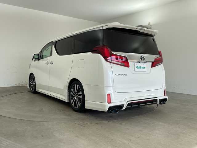 トヨタ アルファード S Cパッケージ 兵庫県 2021(令3)年 2.6万km ホワイトパールクリスタルシャイン ・Wサンルーフ/・社外エアロ/・社外4本出しマフラー/・ダウンサス/・トヨタセーフティーセンス/・プリクラッシュセーフティ/・レーントレーシングアシスト/・クリアランスソナー/・パーキングサポートブレーキ/・リヤクロストラフィックアラート/・BSM/・ロードサインアシスト/・ナノイー/・レーダークルーズコントロール/・オートマチックハイビーム/・純正9型ナビ＆フルセグ＆BT＆USB＆DVD/・バックカメラ/・純正12.1型フリップダウンモニター/・両側パワースライドドア/・パワーバックドア/・ビルトインETC2.0/・ステアリングヒーター/・ステアリングリモコン/・デジタルインナーミラー/・社外前後ドライブレコーダー/・合皮シート/・前席シートヒーター/・前席シートベンチレーション/・運転席メモリーシート/・2列目オットマン/・助手席オットマン/・3眼LEDヘッドライト/・フォグ/・オートライト/・スマートキー/・スペアキー/・プッシュスタート/・電子パーキング/・オートホールド/・純正18インチアルミホイール