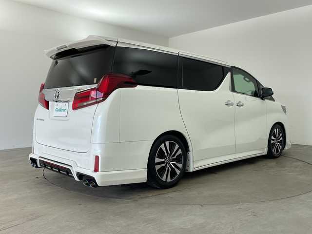 トヨタ アルファード S Cパッケージ 兵庫県 2021(令3)年 2.6万km ホワイトパールクリスタルシャイン ・Wサンルーフ/・社外エアロ/・社外4本出しマフラー/・ダウンサス/・トヨタセーフティーセンス/・プリクラッシュセーフティ/・レーントレーシングアシスト/・クリアランスソナー/・パーキングサポートブレーキ/・リヤクロストラフィックアラート/・BSM/・ロードサインアシスト/・ナノイー/・レーダークルーズコントロール/・オートマチックハイビーム/・純正9型ナビ＆フルセグ＆BT＆USB＆DVD/・バックカメラ/・純正12.1型フリップダウンモニター/・両側パワースライドドア/・パワーバックドア/・ビルトインETC2.0/・ステアリングヒーター/・ステアリングリモコン/・デジタルインナーミラー/・社外前後ドライブレコーダー/・合皮シート/・前席シートヒーター/・前席シートベンチレーション/・運転席メモリーシート/・2列目オットマン/・助手席オットマン/・3眼LEDヘッドライト/・フォグ/・オートライト/・スマートキー/・スペアキー/・プッシュスタート/・電子パーキング/・オートホールド/・純正18インチアルミホイール