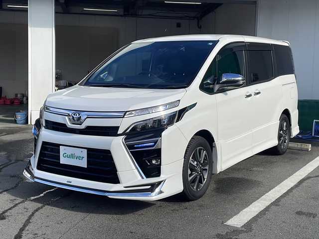 トヨタ ヴォクシー ZS 煌Ⅲ 京都府 2021(令3)年 6.5万km ホワイトパールクリスタルシャイン モデリスタエアロ　純正１０インチナビ　フルセグ　Ｂｌｕｅｔｏｏｔｈオーディオ　ＤＶＤ再生　バックカメラ　プリクラッシュセーフティ　クルーズコントロール　両側パワースライド　ＬＥＤヘッドライト　禁煙車