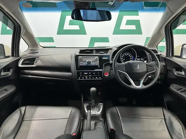 ホンダ フィット 13G L ホンダセンシング 鹿児島県 2018(平30)年 1.1万km プレミアムホワイトパールⅡ 社外オーディオ/Honda SENSING/　・衝突軽減ブレーキ/　・アダプティブクルーズコントロール/　・誤発進抑制機能/　・歩行者事故低減ステアリング/　・ＬＫＡＳ/　・先行車発進お知らせ機能/　・標識認識機能/電動格納ミラー/ＬＥＤヘッドライト/フォグライト/オートライト