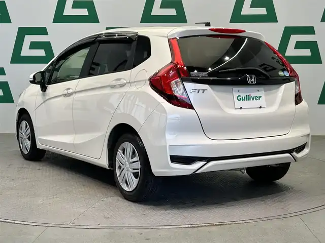ホンダ フィット 13G L ホンダセンシング 鹿児島県 2018(平30)年 1.1万km プレミアムホワイトパールⅡ 社外オーディオ/Honda SENSING/　・衝突軽減ブレーキ/　・アダプティブクルーズコントロール/　・誤発進抑制機能/　・歩行者事故低減ステアリング/　・ＬＫＡＳ/　・先行車発進お知らせ機能/　・標識認識機能/電動格納ミラー/ＬＥＤヘッドライト/フォグライト/オートライト