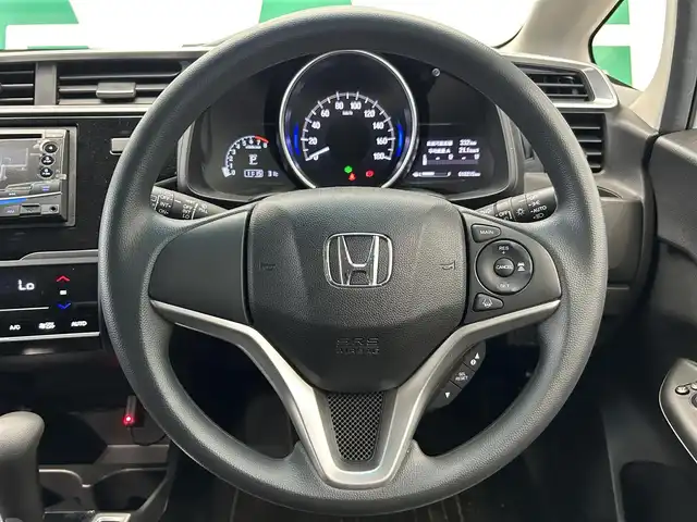 ホンダ フィット 13G L ホンダセンシング 鹿児島県 2018(平30)年 1.1万km プレミアムホワイトパールⅡ 社外オーディオ/Honda SENSING/　・衝突軽減ブレーキ/　・アダプティブクルーズコントロール/　・誤発進抑制機能/　・歩行者事故低減ステアリング/　・ＬＫＡＳ/　・先行車発進お知らせ機能/　・標識認識機能/電動格納ミラー/ＬＥＤヘッドライト/フォグライト/オートライト