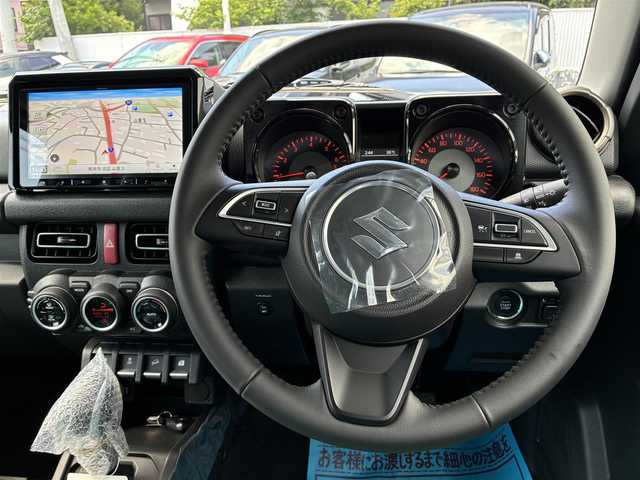 スズキ ジムニー ノマド FC 熊本県 2025(令7)年 0.1万km未満 アークティックホワイトパール ワンオーナー/純正9型ナビ/【フルセグTV/CD/DVD/SD/USB/BT】/バックカメラ/スズキセーフティサポート/デュアルカメラブレーキサポート/先行車発進お知らせ/標識認識機能/車線逸脱警報/誤発進抑制機能/後方誤発進抑制機能/後退時ブレーキサポート/アダプティブクルーズコントロール/ハイビームアシスト/前席シートヒーター/革巻きステアリング/ステアリングリモコン/純正15インチAW/LEDヘッドライト/オートライト/フォグランプ/ヘッドライトレベライザー/前後ドライブレコーダー/アイドリングストップ/スマートキー/スペアキー/プッシュスタート/純正フロアマット/純正サイドデカール/保証書/取扱説明書