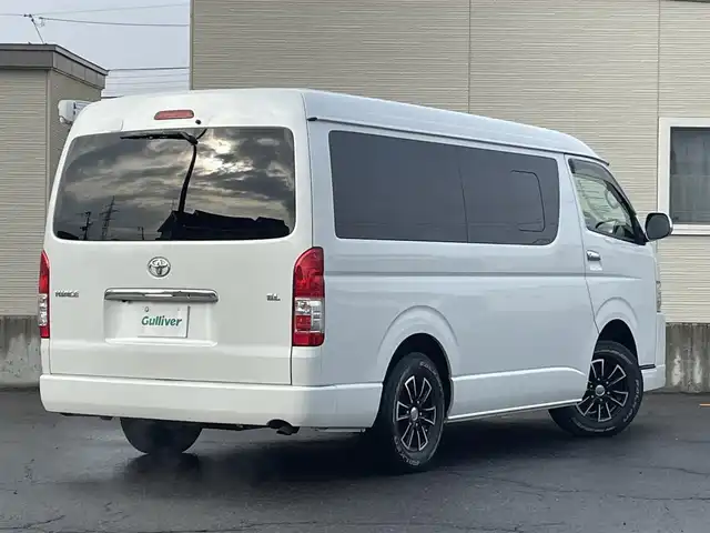 トヨタ ハイエース GL 青森県 2018(平30)年 9.5万km ホワイトパールクリスタルシャイン 4WD/ワンオーナー/モデリスタエアロ　/キャンピング仕様/ベッドキッド/タープ/シンク/フローリング/後席回転対座シート/後席TVモニター有（HDMI用）/WAC/片側パワースライドドア/社外ナビ/・フルセグ/AM/FM/CD/DVD/BT/純正フロアマット/センターコンソール/車線逸脱警報/横滑り防止機能/ヒルスタートアシスト/UVカットガラス/プライバシーガラス/盗難防止装置/オートライト/ETC/スペアキー/純正スターター/保証書/取扱説明書