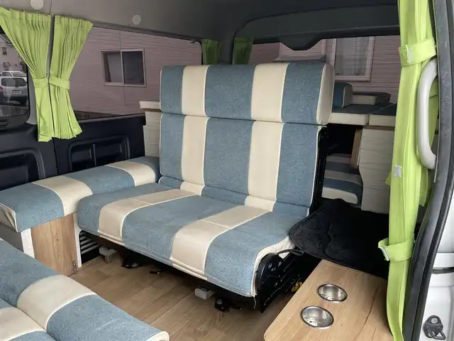 トヨタ ハイエース GL 青森県 2018(平30)年 9.5万km ホワイトパールクリスタルシャイン 4WD/ワンオーナー/モデリスタエアロ　/キャンピング仕様/ベッドキッド/タープ/シンク/フローリング/後席回転対座シート/後席TVモニター有（HDMI用）/WAC/片側パワースライドドア/社外ナビ/・フルセグ/AM/FM/CD/DVD/BT/純正フロアマット/センターコンソール/車線逸脱警報/横滑り防止機能/ヒルスタートアシスト/UVカットガラス/プライバシーガラス/盗難防止装置/オートライト/ETC/スペアキー/純正スターター/保証書/取扱説明書