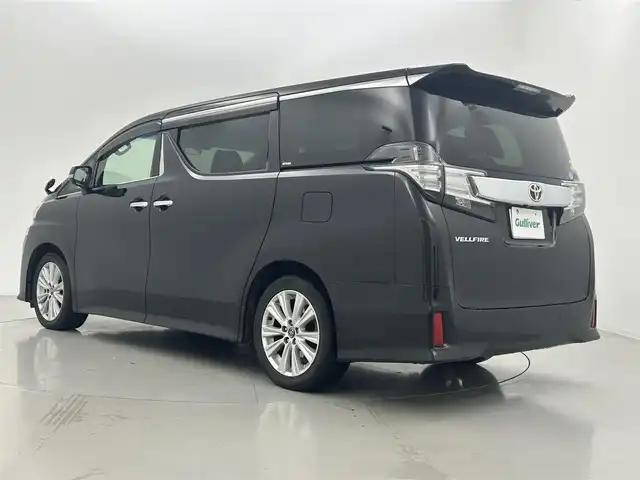 トヨタ ヴェルファイア Z Aエディション 熊本県 2017(平29)年 9.3万km バーニングブラッククリスタルシャインガラスフレーク 禁煙車/アルパインナビ（フルセグ・ＢＴ・ＳＤ・ＣＤ・ＤＶＤ）/アルパイン後席モニター/バックカメラ/ビルトインＥＴＣ　/クルーズコントロール/両側パワースライドドア　/前後クリアランスソナー/横滑り防止/2列目オットマン/純正フロアマット/純正１８インチAW/オートライト/LEDヘッドライト/フォグライト/スマートキー/プッシュスタート/スペアキー1本/保証書/取扱説明書