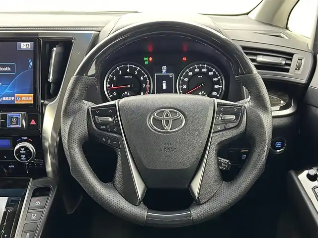 トヨタ ヴェルファイア Z Aエディション 熊本県 2017(平29)年 9.3万km バーニングブラッククリスタルシャインガラスフレーク 禁煙車/アルパインナビ（フルセグ・ＢＴ・ＳＤ・ＣＤ・ＤＶＤ）/アルパイン後席モニター/バックカメラ/ビルトインＥＴＣ　/クルーズコントロール/両側パワースライドドア　/前後クリアランスソナー/横滑り防止/2列目オットマン/純正フロアマット/純正１８インチAW/オートライト/LEDヘッドライト/フォグライト/スマートキー/プッシュスタート/スペアキー1本/保証書/取扱説明書