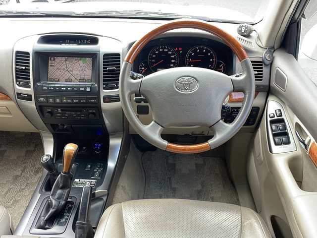 トヨタ ランドクルーザー プラド TZ Gセレクション 広島県 2006(平18)年 15.5万km ホワイトパールクリスタルシャイン /登録時走行距離/　　　　　　　154472キロ/ワンオーナー/メーカーナビ/バックカメラ/ベージュ革シート/シートヒーター/COOL BOX/スペアキー×１/ETC/新車時整備手帳/　　【保証書】/取扱説明書/