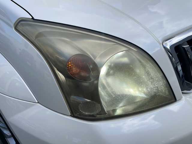 トヨタ ランドクルーザー プラド TZ Gセレクション 広島県 2006(平18)年 15.5万km ホワイトパールクリスタルシャイン /登録時走行距離/　　　　　　　154472キロ/ワンオーナー/メーカーナビ/バックカメラ/ベージュ革シート/シートヒーター/COOL BOX/スペアキー×１/ETC/新車時整備手帳/　　【保証書】/取扱説明書/