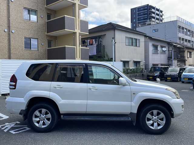トヨタ ランドクルーザー プラド TZ Gセレクション 広島県 2006(平18)年 15.5万km ホワイトパールクリスタルシャイン /登録時走行距離/　　　　　　　154472キロ/ワンオーナー/メーカーナビ/バックカメラ/ベージュ革シート/シートヒーター/COOL BOX/スペアキー×１/ETC/新車時整備手帳/　　【保証書】/取扱説明書/