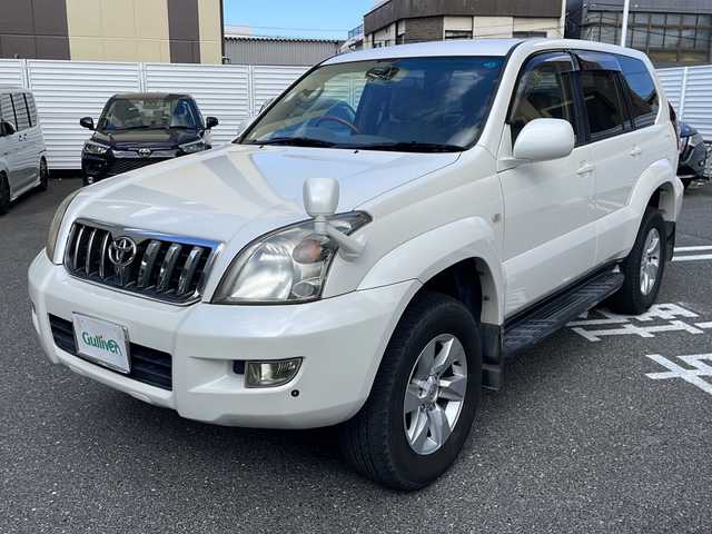 トヨタ ランドクルーザー プラド TZ Gセレクション 広島県 2006(平18)年 15.5万km ホワイトパールクリスタルシャイン /登録時走行距離/　　　　　　　154472キロ/ワンオーナー/メーカーナビ/バックカメラ/ベージュ革シート/シートヒーター/COOL BOX/スペアキー×１/ETC/新車時整備手帳/　　【保証書】/取扱説明書/