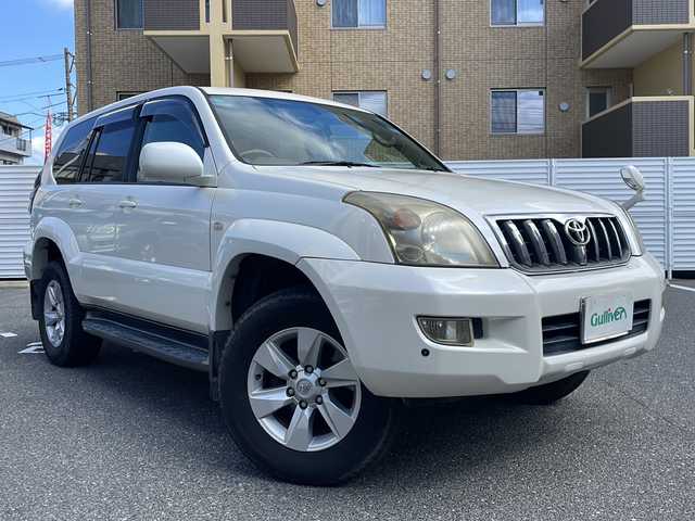 トヨタ ランドクルーザー プラド TZ Gセレクション 広島県 2006(平18)年 15.5万km ホワイトパールクリスタルシャイン /登録時走行距離/　　　　　　　154472キロ/ワンオーナー/メーカーナビ/バックカメラ/ベージュ革シート/シートヒーター/COOL BOX/スペアキー×１/ETC/新車時整備手帳/　　【保証書】/取扱説明書/