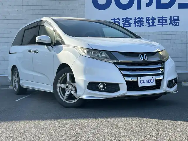 ホンダ オデッセイ アブソルート 長崎県 2015(平27)年 11.1万km ホワイトオーキッドパール (株)IDOMが運営する【じしゃロン長崎店】の自社ローン専用車両になりますこちらは現金またはオートローンご利用時の価格です。自社ローンご希望の方は別途その旨お申付け下さい/パドルシフト/エンジンスタートボタン/MTモード付AT/アイドリングストップ/スマートキー/クルーズコントロール/Bluetooth接続/後席用モニター/ETC/バックカメラ/オートライト/オットマン/純正フロアマット/横滑り防止装置/レーンキープアシスト/衝突被害軽減装置