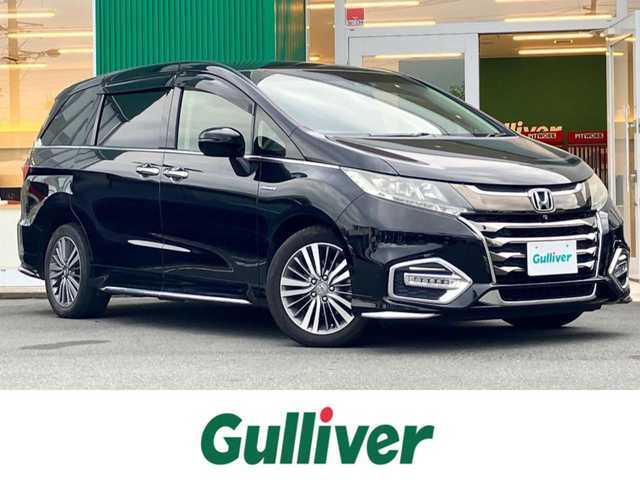 ホンダ オデッセイ ハイブリッド アブソルート・EXホンダセンジング 静岡県 2019(平31)年 8.9万km クリスタルブラックパール エンジンスタートボタン/パワーステアリング/パワーウィンドウ/アイドリングストップ/スマートキー/スペアキー１本/Wオートエアコン/レーダークルーズコントロール/後席モニター/ETC2.0/USB入力端子/全方位カメラ/純正ナビ(CD/DVD/BT/フルセグ)/ドライブレコーダー前後/ウォークスルー/純正フロアマット/D席N席パワーシート/D席N席シートヒーター/両側パワースライドドア/純正アルミホイール/ABS/横滑り防止装置/コーナーセンサー前後/レーンキープアシスト/オートライト/LEDヘッドライト/W+サイドエアバッグ/カーテンエアバッグ/衝突軽減システム/HDMI/BSM/デジタルインナーミラー