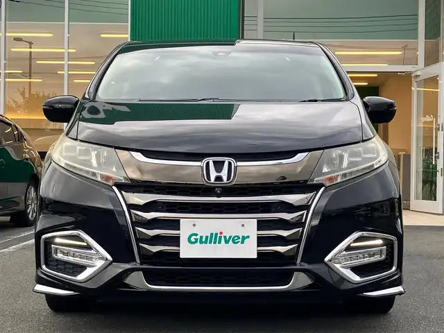 ホンダ オデッセイ ハイブリッド アブソルート・EXホンダセンジング 静岡県 2019(平31)年 8.9万km クリスタルブラックパール エンジンスタートボタン/パワーステアリング/パワーウィンドウ/アイドリングストップ/スマートキー/スペアキー１本/Wオートエアコン/レーダークルーズコントロール/後席モニター/ETC2.0/USB入力端子/全方位カメラ/純正ナビ(CD/DVD/BT/フルセグ)/ドライブレコーダー前後/ウォークスルー/純正フロアマット/D席N席パワーシート/D席N席シートヒーター/両側パワースライドドア/純正アルミホイール/ABS/横滑り防止装置/コーナーセンサー前後/レーンキープアシスト/オートライト/LEDヘッドライト/W+サイドエアバッグ/カーテンエアバッグ/衝突軽減システム/HDMI/BSM/デジタルインナーミラー