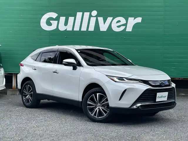 トヨタ ハリアー ハイブリッド G 東京都 2024(令6)年 1.6万km プラチナホワイトパールマイカ ワンオーナー/純正SDナビ/（BTオーディオ）/バックカメラ/ブラインドスポットモニター/セーフティセンス/・レーダークルーズコントロール/・プリクラッシュセーフティ/・カーブ速度抑制機能/・レーントレーシングアシスト/デジタルナインナーミラー/パワーバックドア/ハーフレザーシート/運転席パワーシート/純正18インチアルミ/純正フロアマット/ETC2.0/取扱説明書/保証書