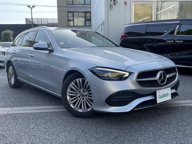 メルセデス・ベンツ Ｃ１８０ ステーションワゴンアバンギャルド 東京都 2022(令4)年 2.3万km ハイテックシルバー レーダーセーフティパッケージ（詳細は検査員記入欄参照）・アダプティブクルーズコントロール/ベーシックパッケージ/3Dコックピッドディスプレイ/ARヘッドアップディスプレイ/ダイナミックセレクト/保証書/取説/スマートキー×２（キーレスゴー）/クライメントコントロール/アイドリングストップ/革巻きステア/電動チルト/ステアリングスイッチ/黒ハーフレザーシート/前メモリ付パワーシート＆シートキネティクス/メルセデスミーコネクト/12.8インチ有機ELメディアディスプレイ/ARナビ・フルセグTV/BT/USB/AppleCarPlay/AndroidAuto/360度カメラシステム・アクティブパーキングアシスト・パークトロニック/2.0ビルトインETC＆外前後ドラレコ＆外レーダー探知機/純正17インチアルミ/LEDパフォーマンスライト・オートライト・リアフォグ/パワーバックドア/AUTOHOLD/置くだけ充電/ルーフレール/トノカバー