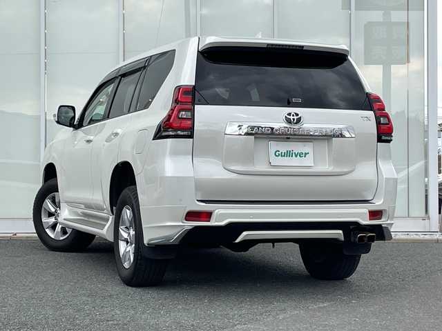 トヨタ ランドクルーザー プラド TX Lパッケージ 福岡県 2021(令3)年 3.6万km ホワイトパールクリスタルシャイン 純正ナビ機能付きディスプレイオーディオ/（AM/FM/USB/BT/Apple CarPlay/フルセグ）/全方位カメラ/モデリスタエアロ（F/S/R)/レーダークルーズコントロール/プリクラッシュセーフティ/ロードサインアシスト/前後コーナーセンサー/レーンキープアシスト/ワンオーナー/ETC2.0/純正フロアマット/レザーシート/D+Nパワーシート/D+N席シートヒーター/エアシート/純正17インチアルミホイール/前後ドライブレコーダー/オートライト/LEDヘッドライト/オートハイビーム