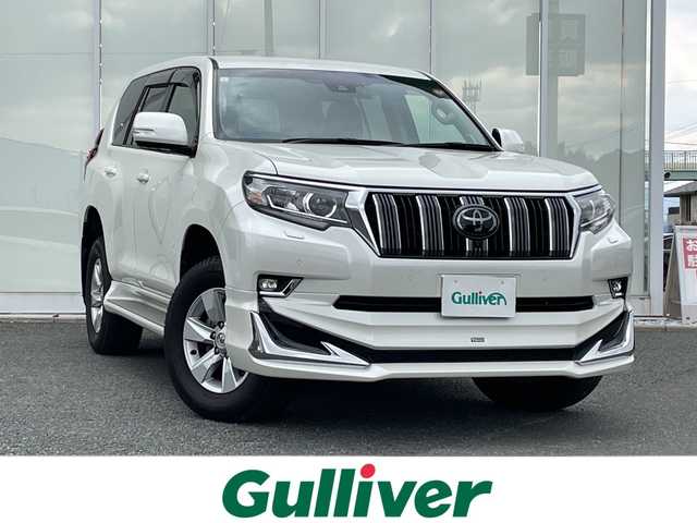 トヨタ ランドクルーザー プラド TX Lパッケージ 福岡県 2021(令3)年 3.6万km ホワイトパールクリスタルシャイン 純正ナビ機能付きディスプレイオーディオ/（AM/FM/USB/BT/Apple CarPlay/フルセグ）/全方位カメラ/モデリスタエアロ（F/S/R)/レーダークルーズコントロール/プリクラッシュセーフティ/ロードサインアシスト/前後コーナーセンサー/レーンキープアシスト/ワンオーナー/ETC2.0/純正フロアマット/レザーシート/D+Nパワーシート/D+N席シートヒーター/エアシート/純正17インチアルミホイール/前後ドライブレコーダー/オートライト/LEDヘッドライト/オートハイビーム