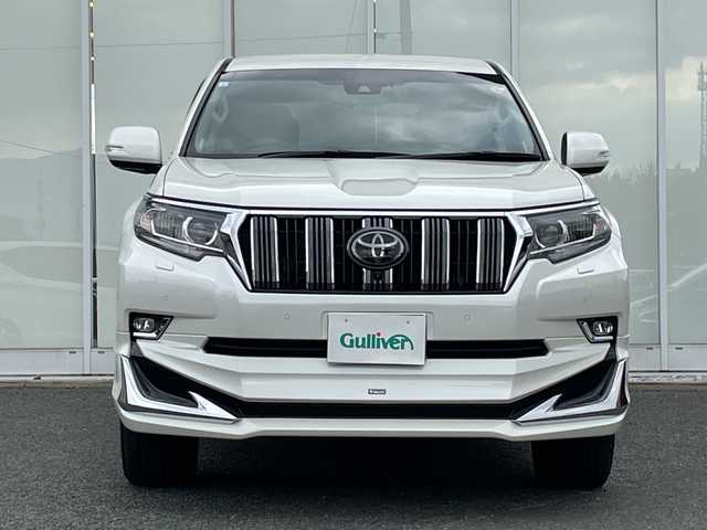 トヨタ ランドクルーザー プラド TX Lパッケージ 福岡県 2021(令3)年 3.6万km ホワイトパールクリスタルシャイン 純正ナビ機能付きディスプレイオーディオ/（AM/FM/USB/BT/Apple CarPlay/フルセグ）/全方位カメラ/モデリスタエアロ（F/S/R)/レーダークルーズコントロール/プリクラッシュセーフティ/ロードサインアシスト/前後コーナーセンサー/レーンキープアシスト/ワンオーナー/ETC2.0/純正フロアマット/レザーシート/D+Nパワーシート/D+N席シートヒーター/エアシート/純正17インチアルミホイール/前後ドライブレコーダー/オートライト/LEDヘッドライト/オートハイビーム