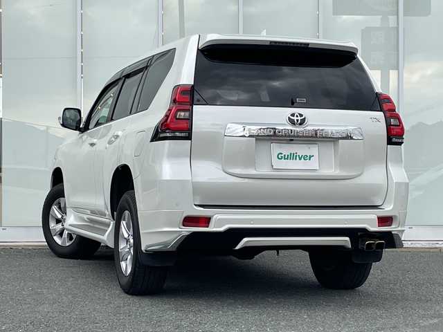 トヨタ ランドクルーザー プラド TX Lパッケージ 福岡県 2021(令3)年 3.6万km ホワイトパールクリスタルシャイン 純正ナビ機能付きディスプレイオーディオ/（AM/FM/USB/BT/Apple CarPlay/フルセグ）/全方位カメラ/モデリスタエアロ（F/S/R)/レーダークルーズコントロール/プリクラッシュセーフティ/ロードサインアシスト/前後コーナーセンサー/レーンキープアシスト/ワンオーナー/ETC2.0/純正フロアマット/レザーシート/D+Nパワーシート/D+N席シートヒーター/エアシート/純正17インチアルミホイール/前後ドライブレコーダー/オートライト/LEDヘッドライト/オートハイビーム