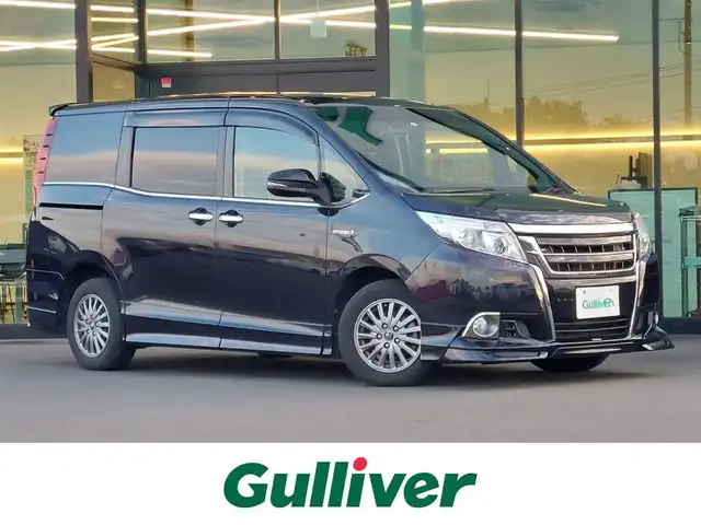 トヨタ エスクァイア ハイブリッド Xi 東京都 2015(平27)年 12.6万km スパークリングブラックパールクリスタルシャイン ALPINE10インチナビ/CD/DVD/BT/AM/FM/フルセグTV/HDMI/USB/バックカメラ/TRDフルエアロ/TRDフロントグリル/両側パワースライドドア/前席シートヒーター/HIDヘッドライト/フォグランプ/アイドリングストップ/横滑り防止装置/純正アルミホイール/保証書・取説・スペアキー