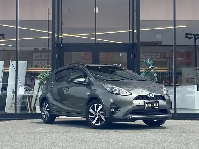 トヨタ アクア クロスオーバー グラム 福岡県 2019(令1)年 6.2万km オリーブマイカM ・純正SDナビ/Bluetooth/CD/DVD/・バックカメラ/・ハーフレザーシート/シートヒーター/・ドライブレコーダー/・フルセグ/・ETC/・純正16AW/・プッシュスタート/・アイドリングストップ/・スマートキー/・スペアキー/・レーンキープアシスト/・オートライト/・LEDライト/・保証書/・取扱説明書/・記録簿