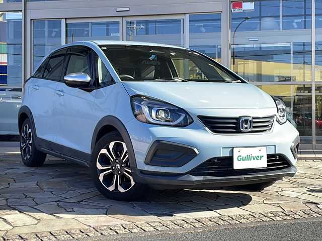ホンダ フィット e:HEVクロスター 静岡県 2022(令4)年 3万km サーフブルー 純正SDナビ/・CD/・DVD/・フルセグＴＶ/・Bluetooth/・USB/・AM/・FM/主要装備/・衝突軽減/・レーンキープ/・追従クルコン/・コーナーセンサー後/・バックカメラ/・ETC/・ドラレコ前後/・電動パーキングブレーキ/・オートホールド/・純正フロアマット/・純正アルミホイール/・スマートキー/・プッシュスタート/・スペアキー1本/・LEDヘッドライト/・オートライト